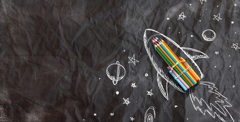 Wall Mural - Back to school theme with hand drawn rocket and colored pencils - crumpled paper background