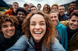 © StockWorld - Multicultural group of young people smiling together at camera - Happy friends taking selfie pic with smartphone outdoors - Life style concept with guys and girls. Model by AI generative