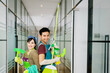 © Creativa Images - Group of young hard working professional cleaners in an office aisle