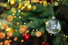 Transparent Ornament On Sparkling Christmas Tree Background. 