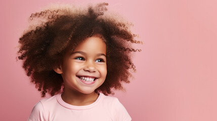 Happy smiling little cute African-american girl, with afro hair