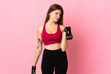 Young Slovak Woman Isolated On Pink Background Making Weightlifting With Kettlebell