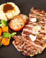 Canvas Print - Striploin angus steak with mashed potato and grilled vegetable