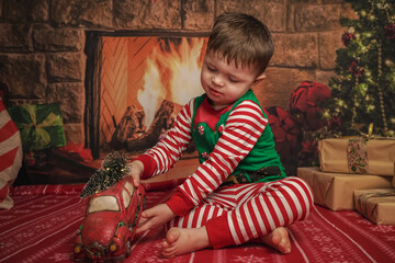 Wall Mural - happy little boy playing at christmas 