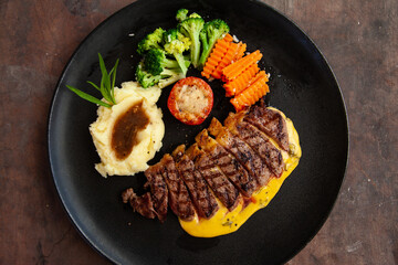 Wall Mural - Striploin angus steak with mashed potato and grilled vegetable