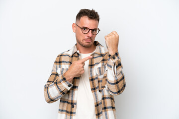 Poster - Young caucasian handsome man isolated on white background making the gesture of being late