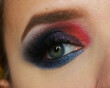 Make-up with close-up of a woman's eye with beautiful dark arabic colorful makeup