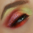 Chinese New Year makeup with golden yellow and red. Glitter bold eye makeup for festivals.
