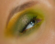 Shimmery green eye makeup with duchrome eye shadow and natural lashes