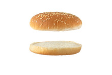 Sesame bun for burger top and bottom separated side view isolated transparent png. Round bread topped with sesame seeds cut in half.