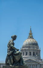 San Francisco, CA, USA - July 12, 2023: Pioneer Monumemt On Fulton Street, Woman Impersonating Plenty Statue On North Side. City Hall Dome As Backdrop Against Blue Sky