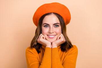 Wall Mural - Close up photo of lovely cute cheerful lady arms touch chin dressed trendy clothes enjoy fall walking isolated on beige color background