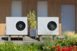 Ecological dual air source heat pumps in front of a contemporary house