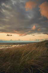 Wall Mural - Colorful Clouds at evening in northern Denmark Coast. High quality photo