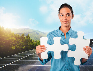 Woman holds two pieces of puzzle over a roof with solar panels