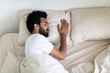 © Prostock-studio - Calm young indian man sleeping on comfortable bed at home