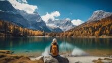 Travelers Couple Look At The Mountain Lake. Travel And Active Life Concept With Team. Adventure And Travel In The Mountains Region In The Austria Generative AI