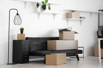 Poster - Interior of light office with cardboard boxes on moving day