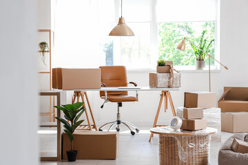 Sticker - Interior of stylish office with cardboard boxes on moving day