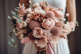 Fototapeta Boho - The bride holds a bouquet in boho style