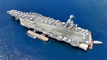 Aerial Drone Photo Of Latest Technology American Flag Nuclear Aircraft Carrier USS Gerald Ford Anchored In Deep Blue Sea
