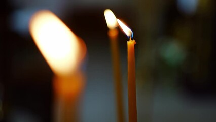 Sticker - burning candles in the church on the altar.