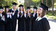 © Михаил Решетников - Group of happy students in graduation gowns outdoors. A young girl in the foreground.