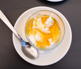 Poster - Sweet dessert of curd cheese and honey served with teaspoon on the table