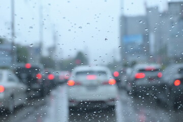 Wall Mural - traffic on highway with cars on rainy day, blur background