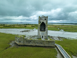 Sticker - Aerial view of Carrigafoyle castle ruins in Ireland, large Gothic tower house surrounded by water