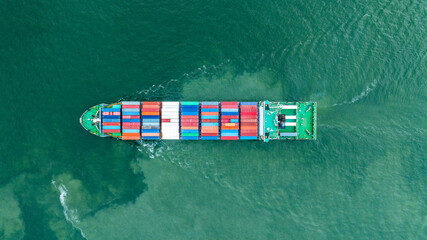 Aerial top view of cargo container ship carrying container from custom container depot go to ocean concept freight shipping by ship service on blue sky .Freight Forwarding Service