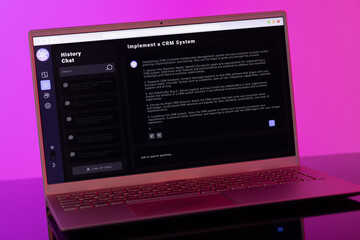 Wall Mural - Laptop screen with data processing on neon pink background