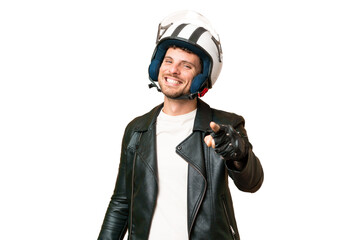 Wall Mural - Brazilian man with a motorcycle helmet over isolated chroma key background pointing front with happy expression