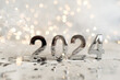 © Ксения Овчинникова - happy new year 2024 background new year holidays card with bright lights,gifts and bottle of hampagne