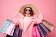 Photo of pretty millennial lady carry many packs shopper tourism abroad look unbelievable sales low prices mall wear fluffy jacket sun specs hat isolated pink background