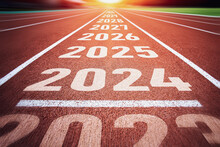 Start Of New Year. Changes Of Year 2024, 2025, 2026 On Running Track. Concept Of New Ideas Starting In New Year, Planning Along With Setting Objectives To Set KPI Goals For Success In Life.