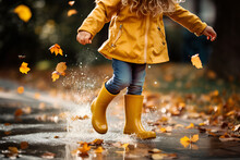 A Girl In Yellow Rubber Boots Runs Through Autumn Puddles 3