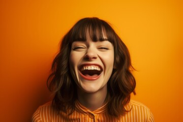 Wall Mural - Medium shot portrait photography of a grinning girl in her 30s sticking out tongue at camera against a tangerine orange background. With generative AI technology