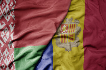 big waving national colorful flag of belarus and national flag of andorra .