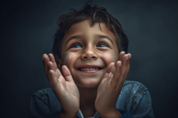 Poster - Close-up portrait photography of a joyful kid male joining palms in a gesture of gratitude against a metallic silver background. With generative AI technology