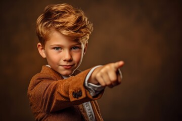 Wall Mural - Close-up portrait photography of a glad kid male pointing with two hands and fingers to the side against a copper brown background. With generative AI technology