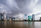 Fototapeta  - View of Ho Chi Minh City from District 2, dark clouds are pulling towards the center