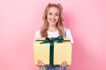 Poster - Photo portrait of lovely young lady hold giftbox celebrate present box wear trendy flower print garment isolated on pink color background