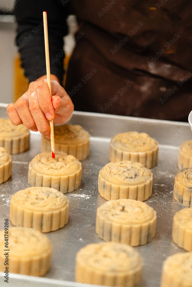 Mooncake making process. A mooncake is a Chinese bakery product ...
