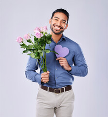 Wall Mural - Purple heart, portrait and asian man with roses in studio for thank you, gift or care on grey background. Paper, frame and Japanese male model with flower, bouquet or offer, love or valentines day
