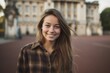 Environmental portrait photography of a blissful girl in her 20s wearing a comfy flannel shirt at the buckingham palace in london england. With generative AI technology