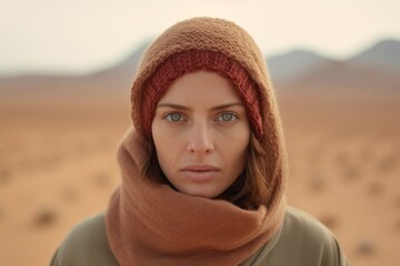 Wall Mural - Conceptual portrait photography of a glad girl in her 40s wearing a warm wool sweater at the mecca in saudi arabia. With generative AI technology