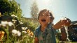 © Banana Images - little child having fun to play with the water in the garden, youth and divertment concept