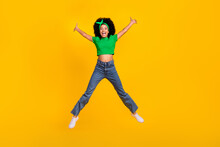 Full Body Portrait Of Active Overjoyed Person Jumping Raise Hands Make Star Figure Isolated On Yellow Color Background