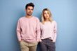 © Tuyres - Portrait of a Cute Fictional Couple Wearing Plain Casual Clothes. A Man and a Woman Isolated on a Plain Colored Blank Background. Generative AI Illustration.